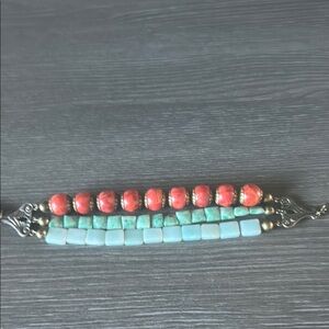 Vibrant Red and Blue Beaded Bracelet with Linear Design